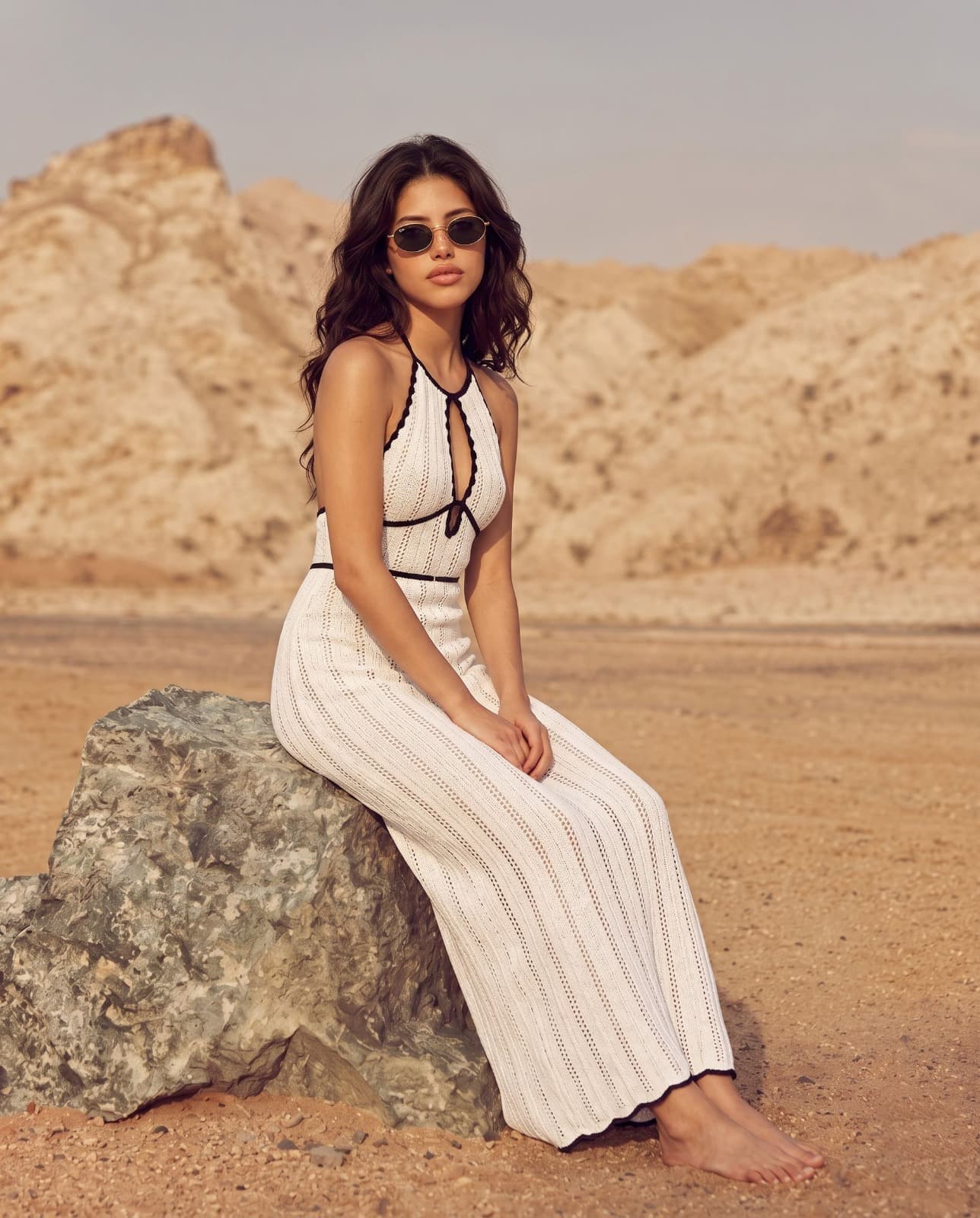 Woman in white knit halter dress, desert campaign