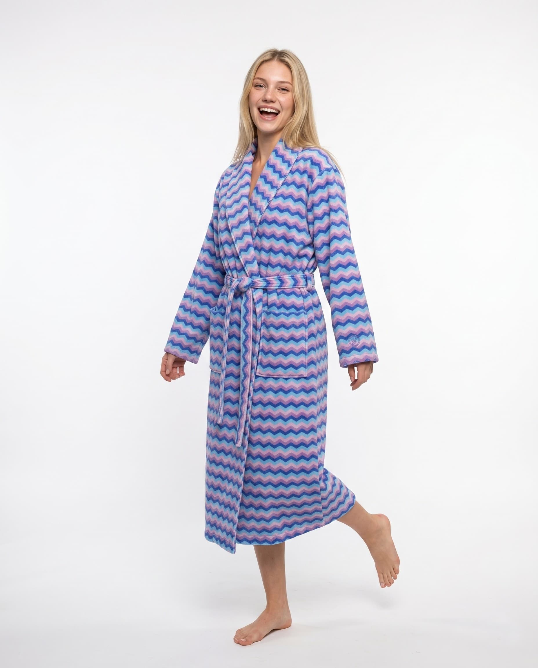 Woman in colourful wave pattern robe, studio shot