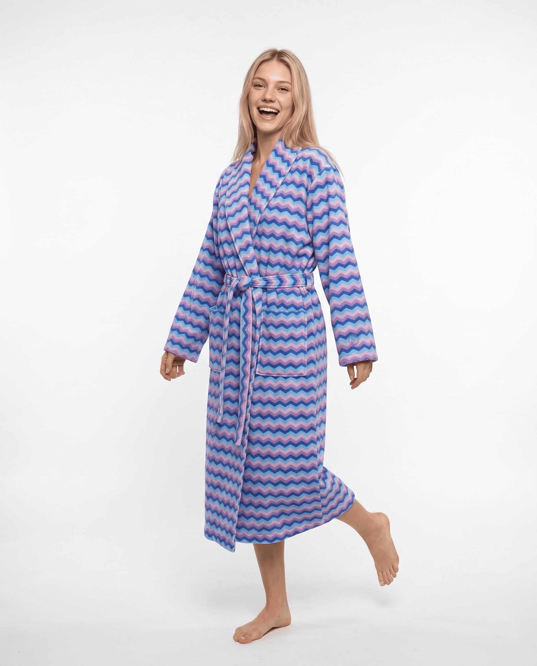 Woman in colourful wave pattern robe, studio shot