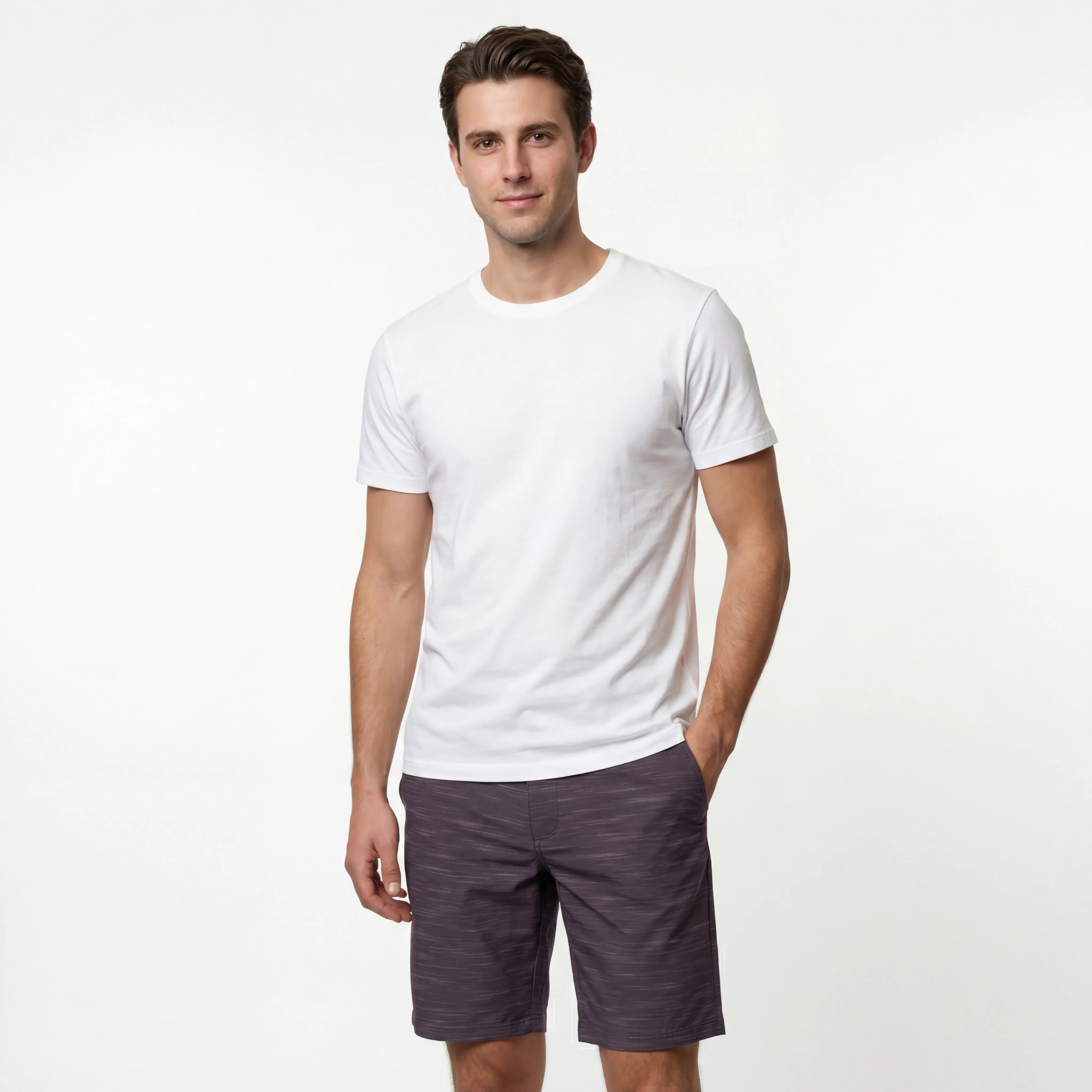 Man in white shirt and gray shorts, studio shot