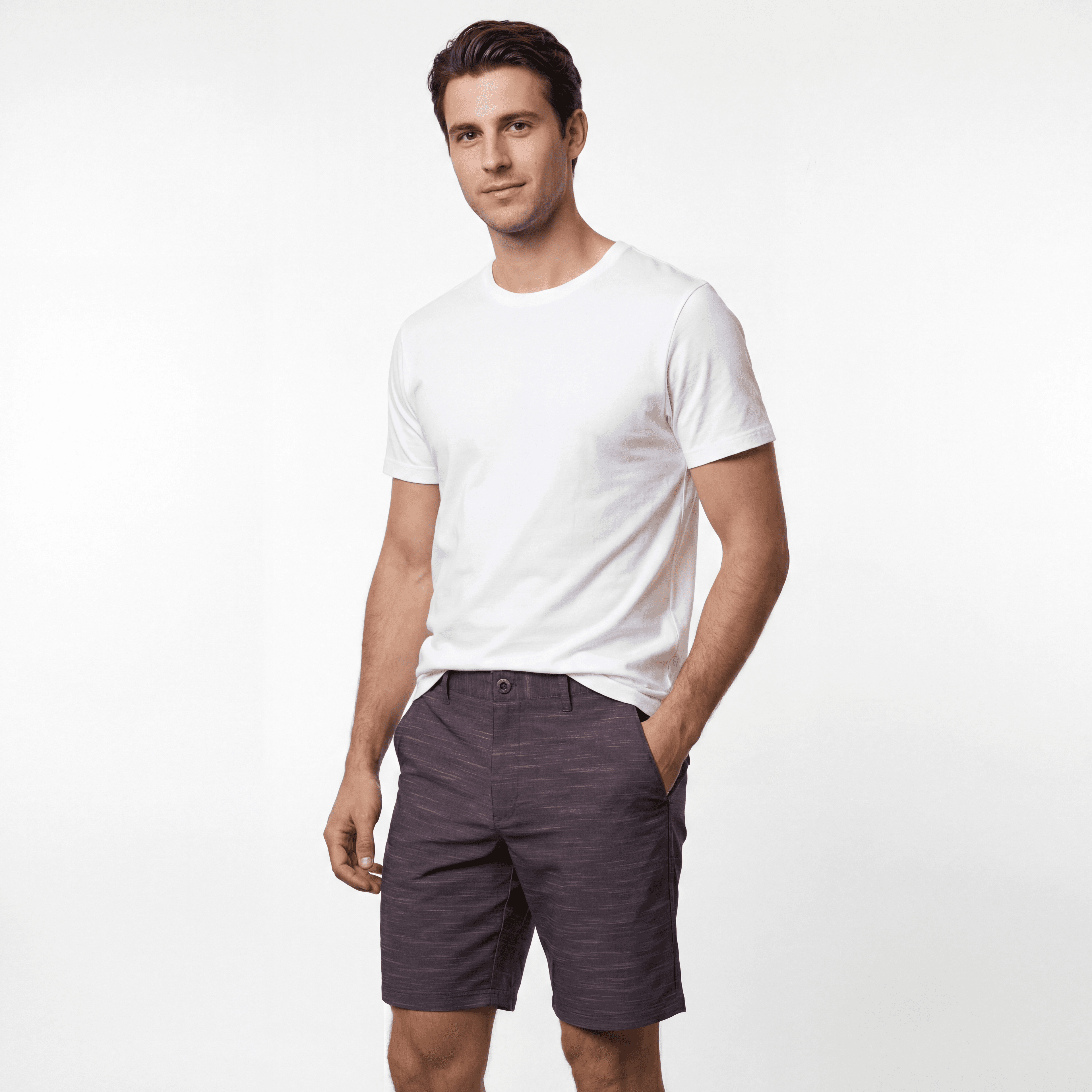 Man in white shirt and gray shorts, studio shot